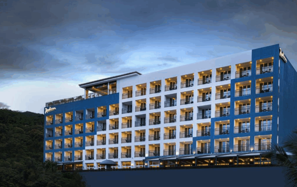 The rooftop infinity pool at Radisson Hotel Kandy offers sweeping views of Kandy’s cityscape.