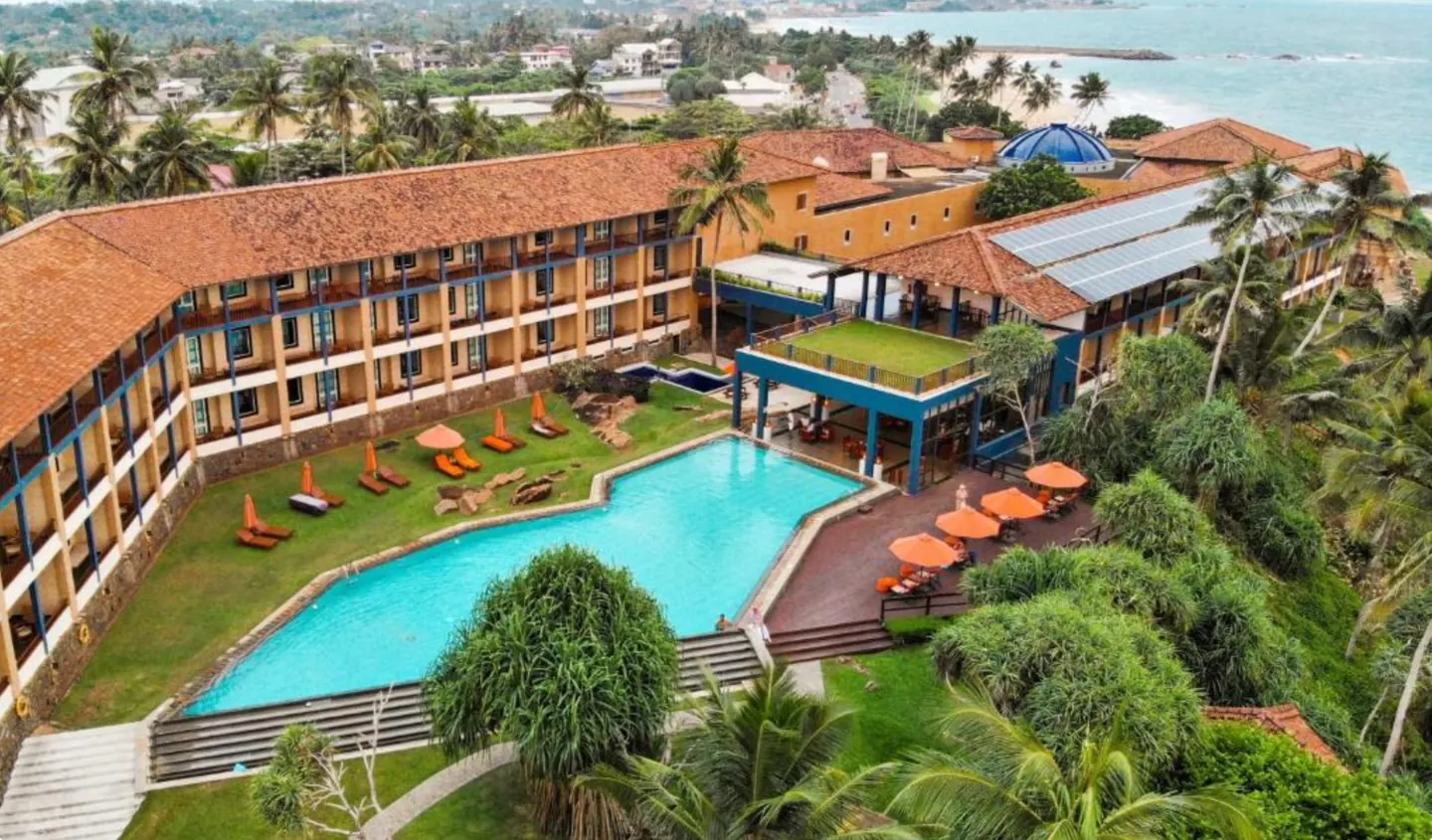 Jetwing Lighthouse exterior and pool beside the Indian Ocean