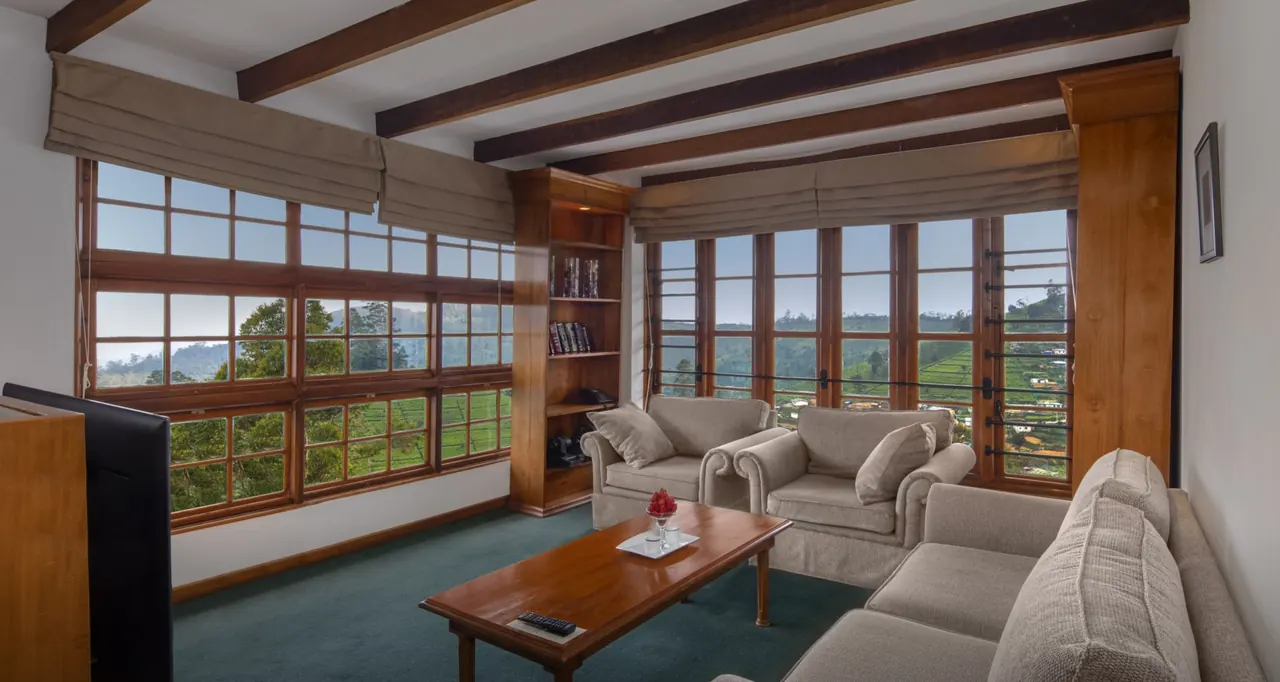 Window-lined living room in the Heritance Tea Factory Flowerdew Suite